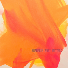 orange letterpress piece with text "remember what matters"