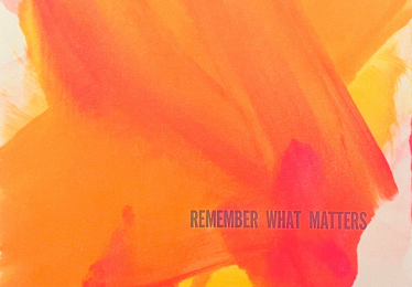 orange letterpress print with text "remember what matters"