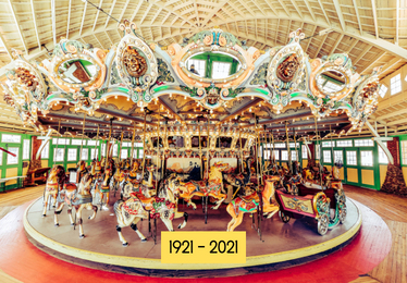 100 year old Dentzel Carousel in color with a menagerie of colorful animals