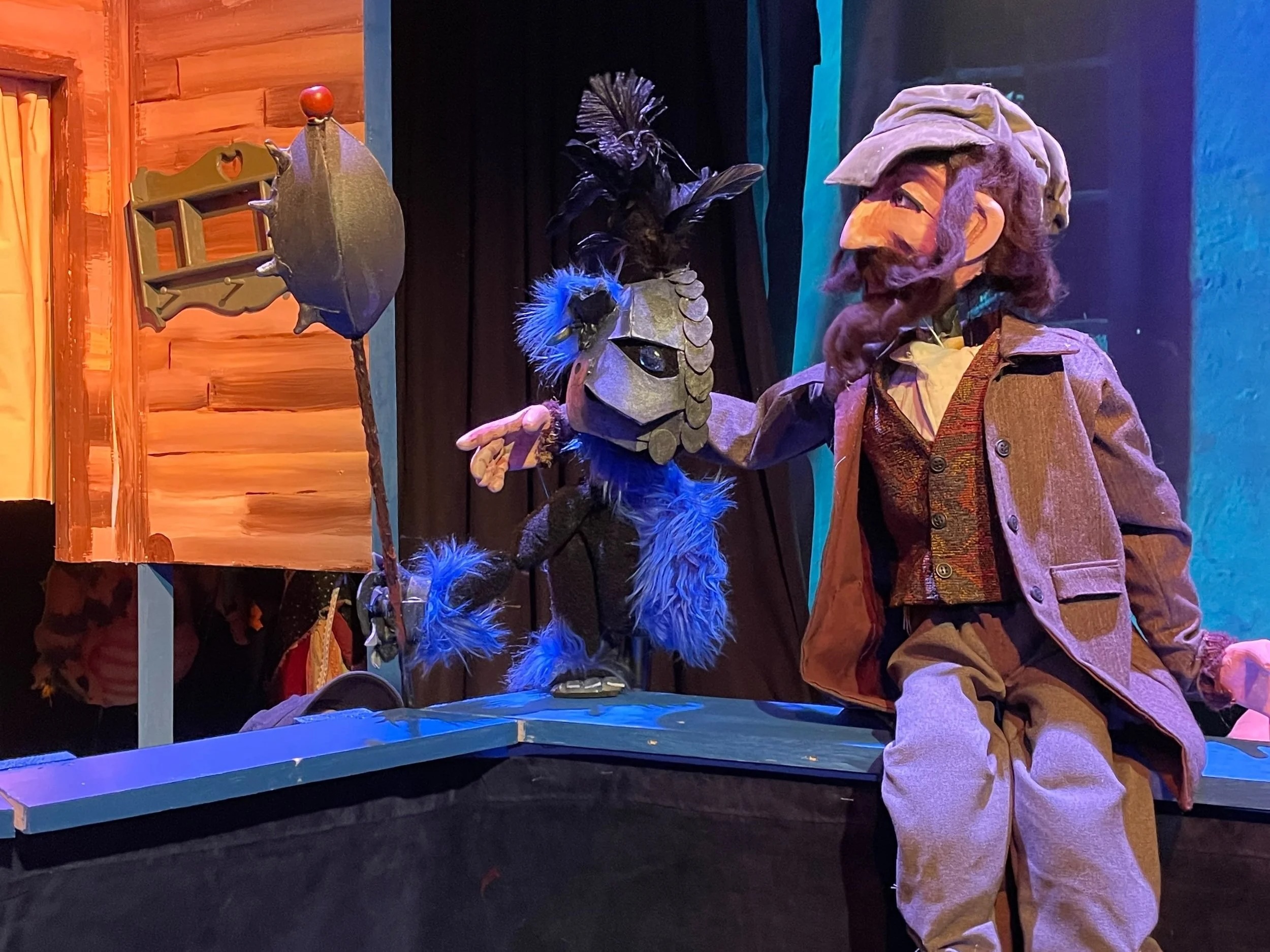 puppets sit on a stage