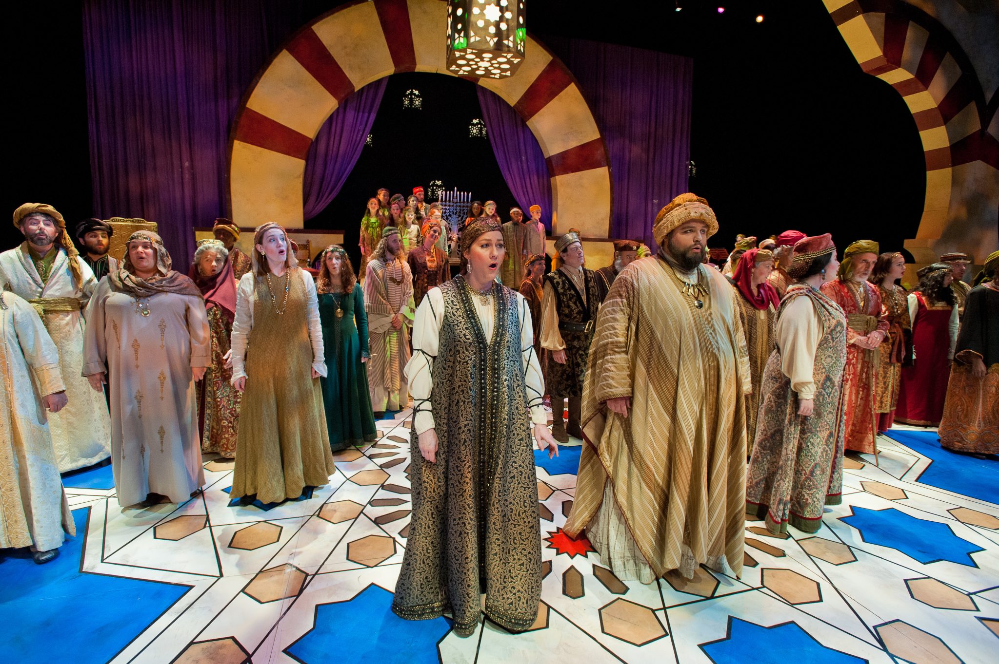 Performers in costume on a stage