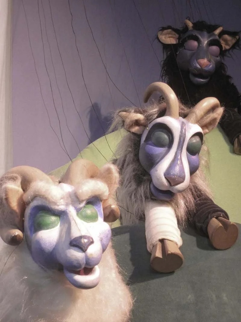 three goat puppets