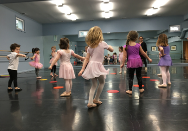 kids dancing in a creative movement class in the hall of mirrors dance studio