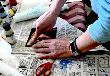 mixed media artist working - hands only