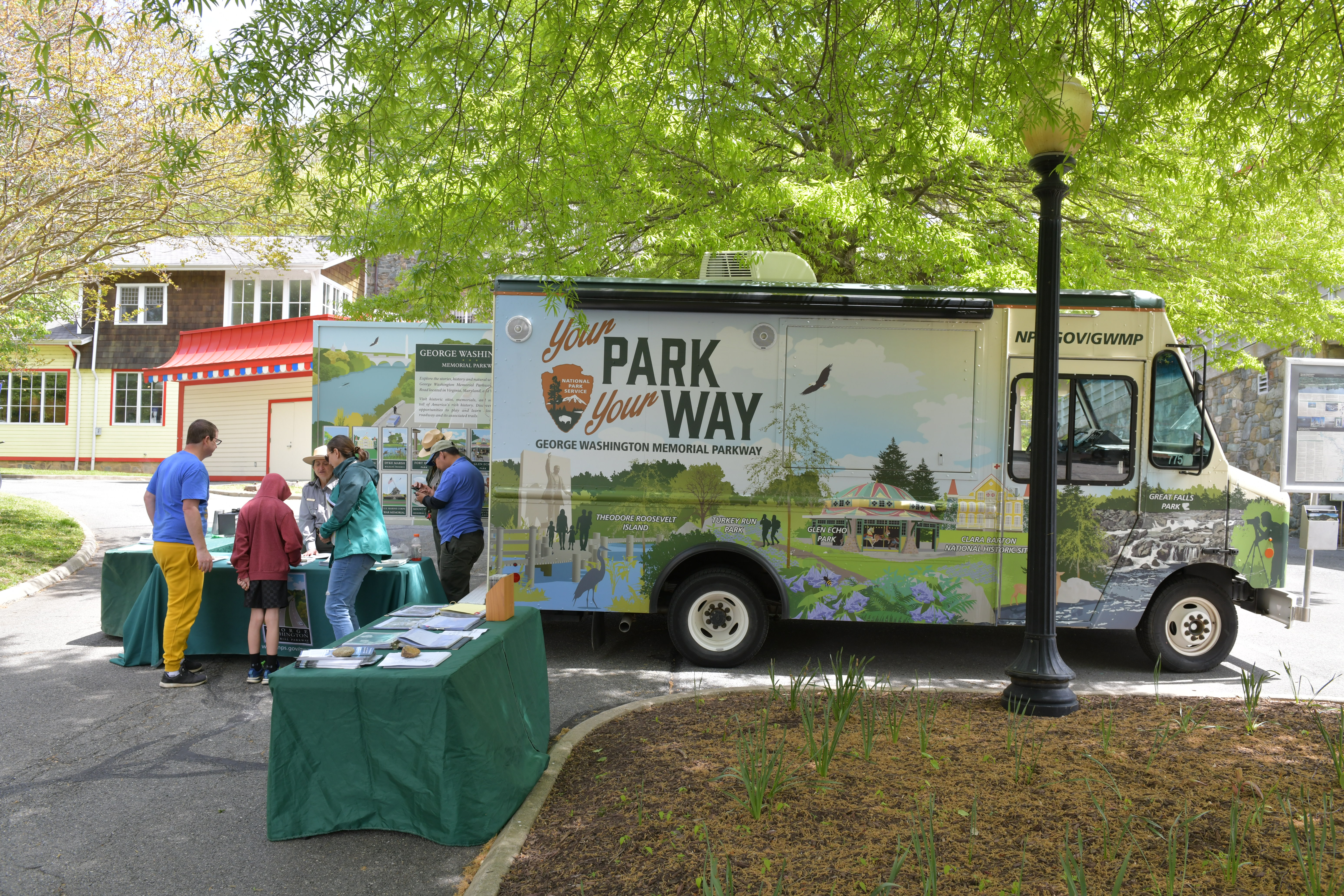 A truck with visitors outside