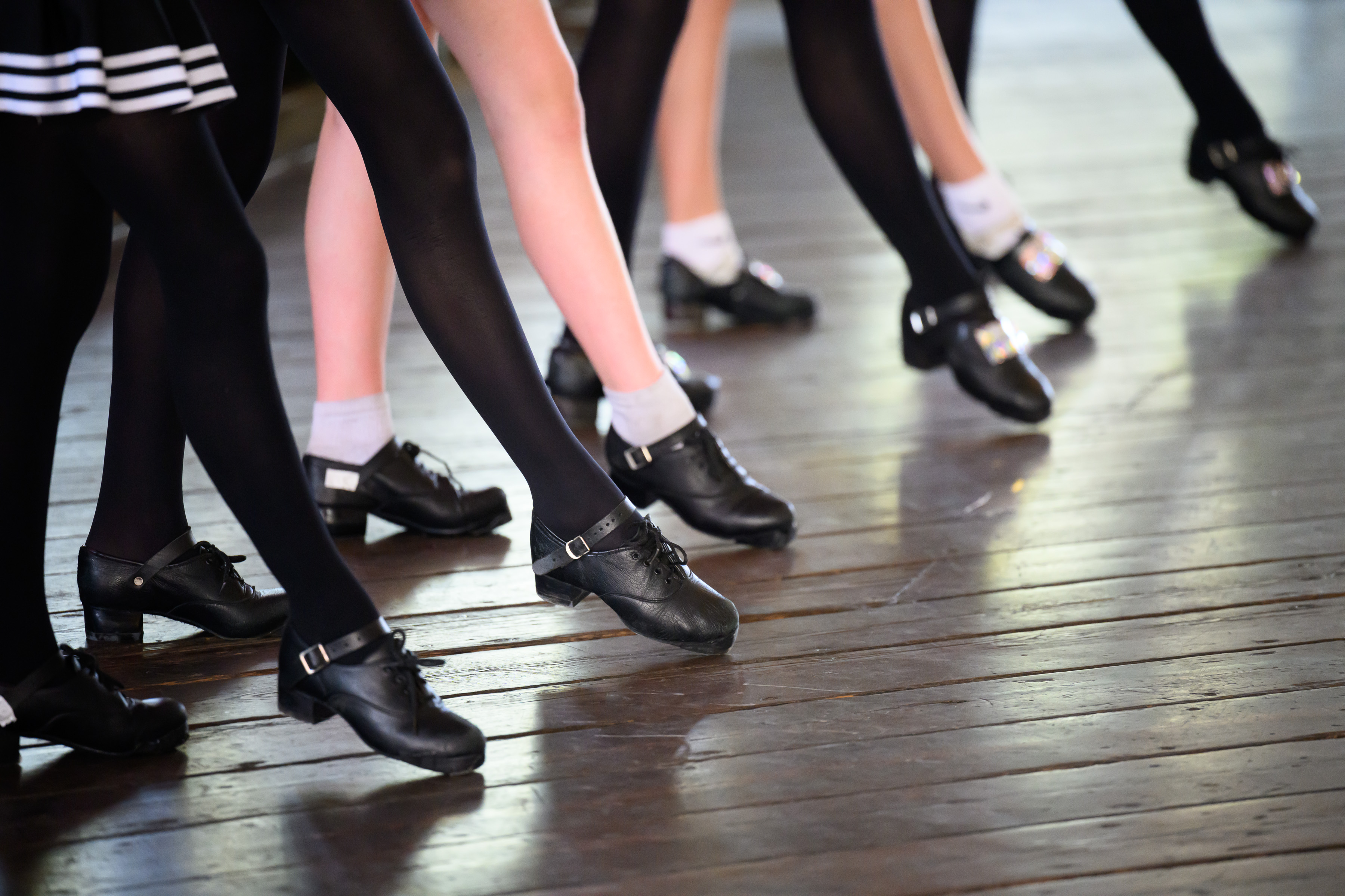 Irish dancers perform on a stage