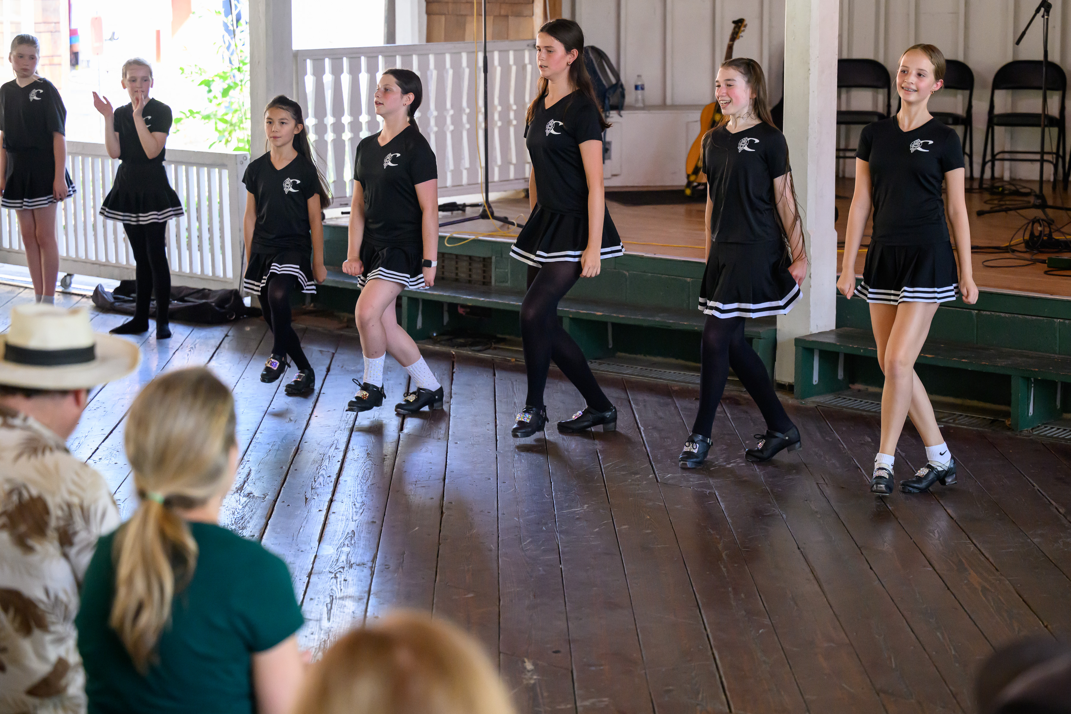 Irish dancers perform on a stage