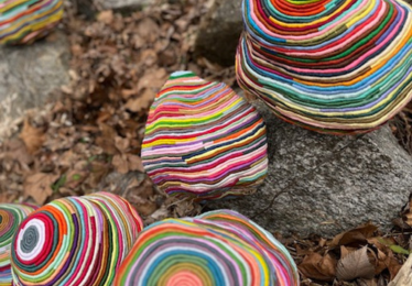 rainbow textile art on rocks
