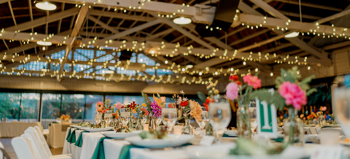 Image of Bumper Car Pavilion Event with Colorful Flowers and Fancy Table Settings