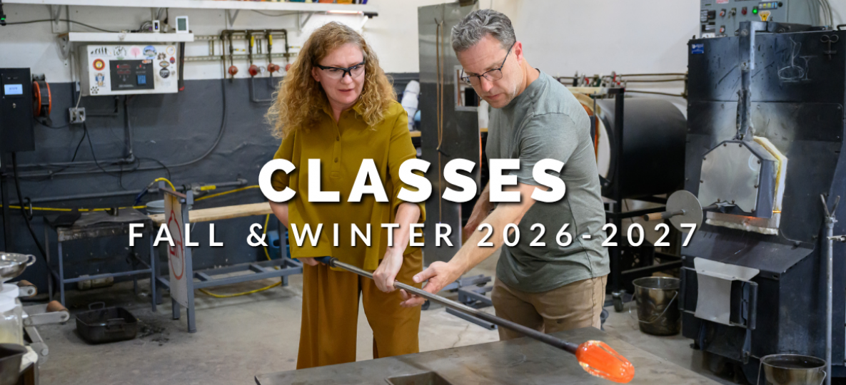 A teacher and student glassblowing