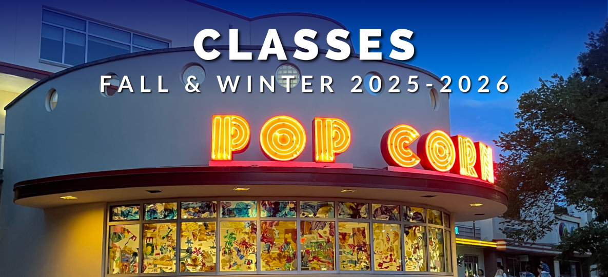 A neon sign reads pop corn