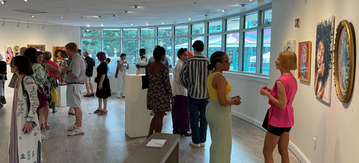 Reception in Popcorn Gallery during August 2023 Art Walk; people mingling and enjoying the artwork