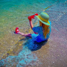 Photo of a child playing in the surf