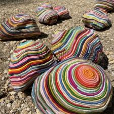 asymmetrical textile orbs on gravel