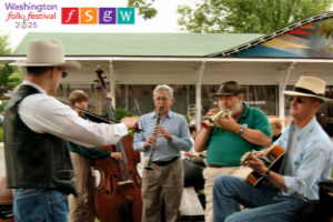 Group of people playing instruments outside with Washington Folk Festival logo in top left corner
