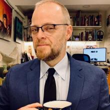 A photo of a man in a suit