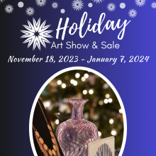 Blue with snowflakes and an image of a a vase, necklace, and painting
