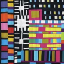 colorful textile piece made up of overlapping squares and rectangles