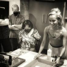 Black and white image of people making photo prints