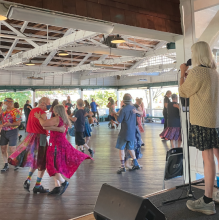 Caller on Bumper Car Pavilion stage, dancers on the floor