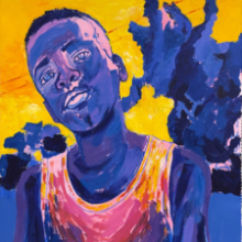 Portrait of boy in yellow, blue, and red